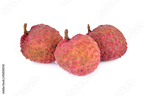 unpeeled ripe lychee fruit on white background