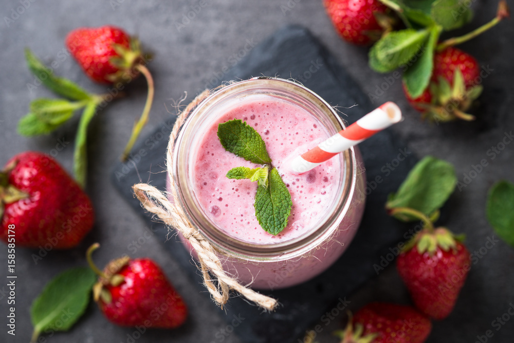 Strawberry milkshake or smoothie in glass jar Strawberry milkshake or smoothie in glass jar