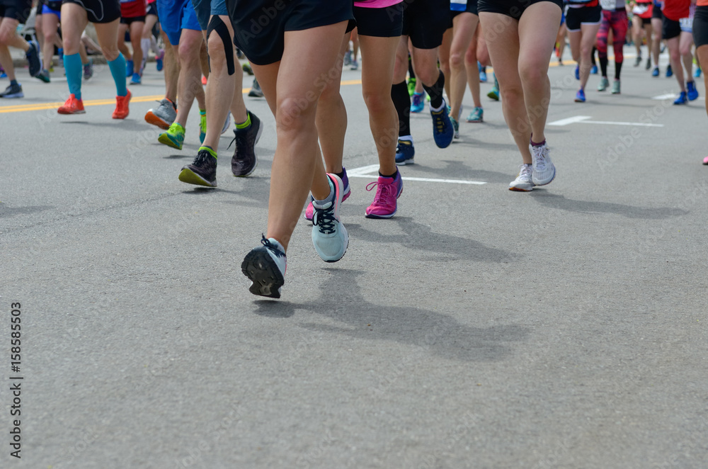 Marathon running race, many runners feet on road, sport, fitness and healthy lifestyle concept
Marathon running race, many runners feet on road, sport, fitness and healthy lifestyle concept