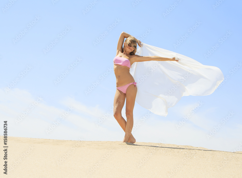 Tanned young female relaxing on the beach Tanned young female relaxing on the beach