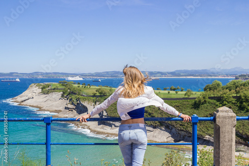 Young woman enjoying sea view vacation