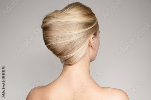 Portrait Of A Beautiful Young Blond Woman With Shell Hairstyle.