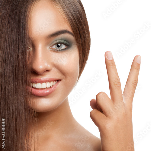 Happy smiling woman with straightened hair.