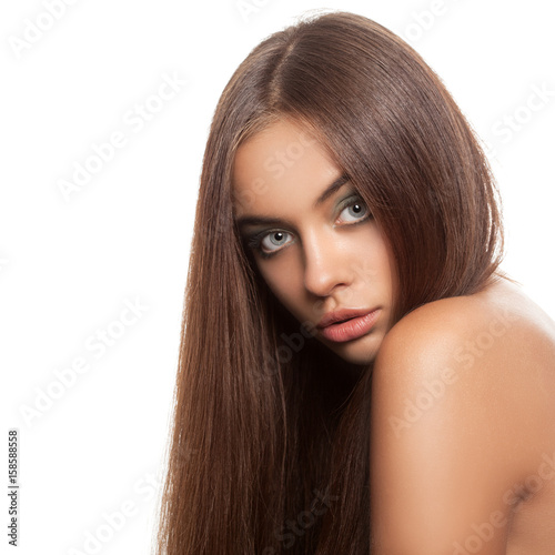 Beautiful woman with straightened hair. White background.