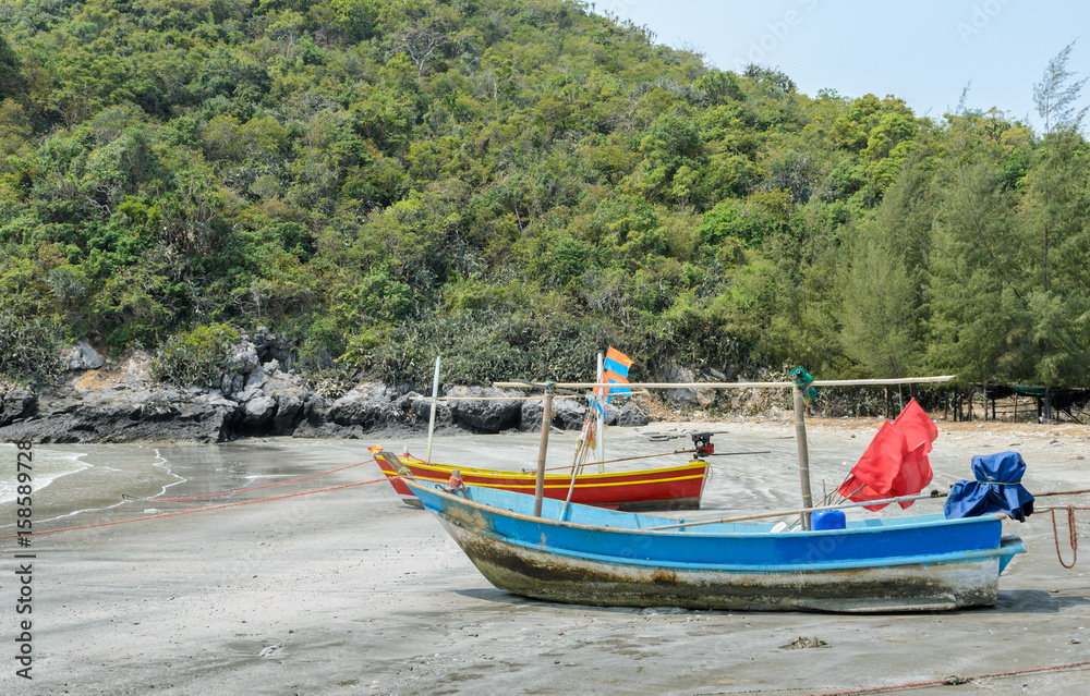 Small fishing boats on beach in Thailand