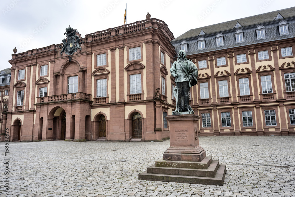 Germany, Baden-Wuerttemberg, Mannheim, Mannheim Baroque Palace (Schloss), University - May 2017: Main entrance with statue of the Great Elector Karl Ludwig in the courtyard