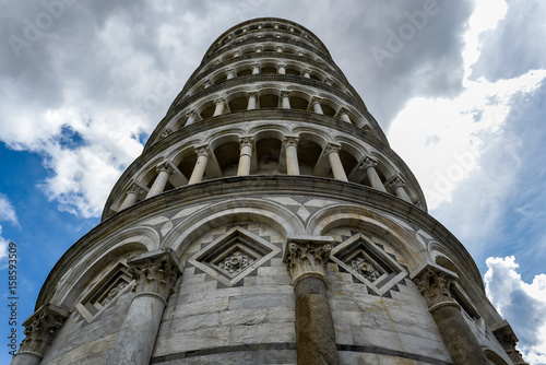 Leaning tower of Pisa in Piazza dei Miracoli in Italy photographed from below