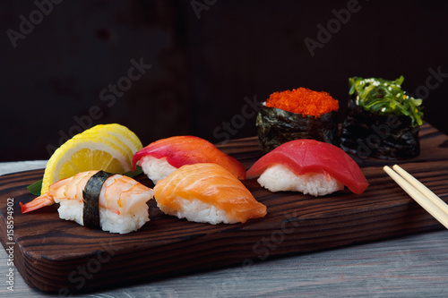 Fresh Sushi set with salmon, prawns and tuna. Traditional Japanese cuisine.