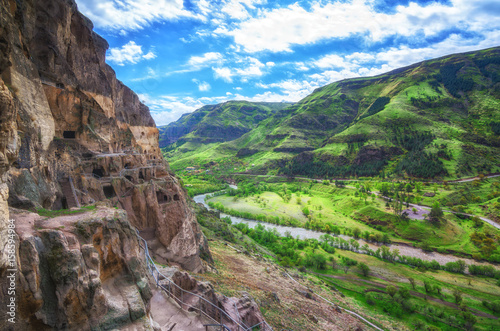 Tourists visiting Vardzia ancient cave city on a spring day in May. Vardzia is one of the main attraction in Georgia