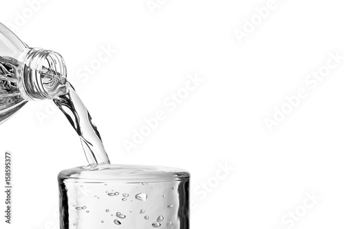 Pouring water over glass on white background with space for text, close-up