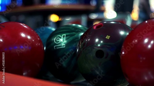 Colored bowling balls in bowling club close up