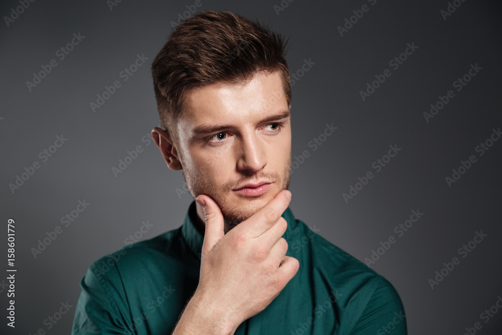 Concentrated serious young man posing isolated Concentrated serious young man posing isolated