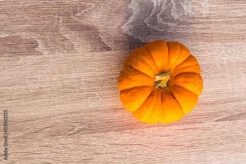 Fancy pumpkin on wooden table