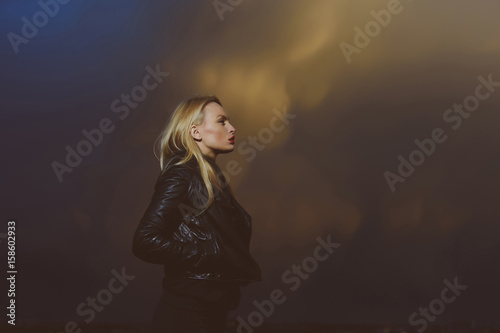 woman with red lips in leather jacket