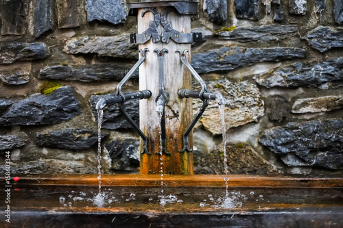 close up pf running water from fountain in Swiss - mineral water