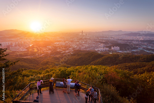 SEOUL; KOREA; -; SEPTEMBER 27; 2015: Seoul city skyline in sunset The best view at Namhansanseong Fortress.