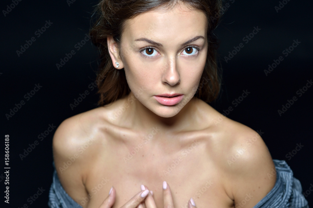Torso portrait of the beautiful woman with naked shoulders Torso portrait of the beautiful woman with naked shoulders