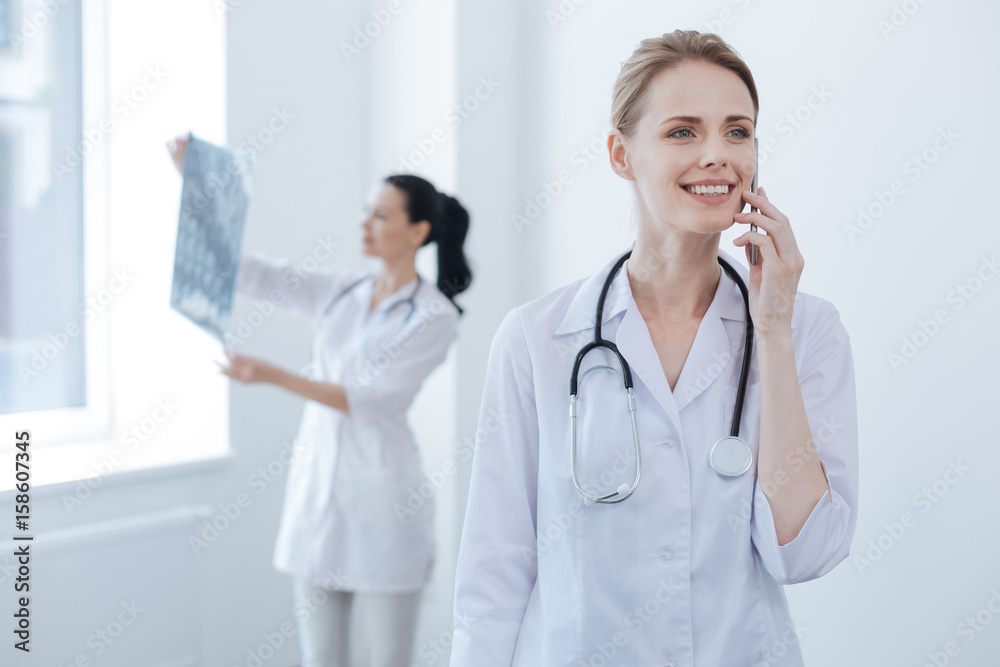 Delighted doctor having conversation at the medical lab Delighted doctor having conversation at the medical lab