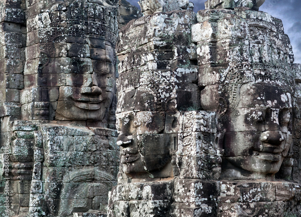 Giant stone faces - ancient reliefs of Prasat Bayon Temple, Cambodia