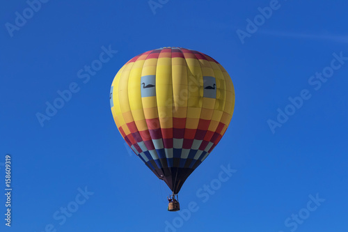 Balloon floating above winery at Temecula Balloon Festival in Southern California © kgrif