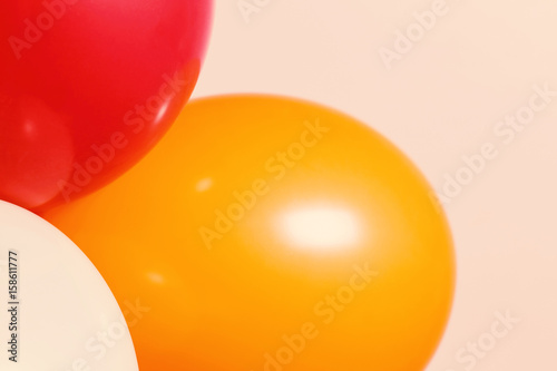 Close up curve of balloons on the white wall.Used film filter for soft tone color. © lufeethebear