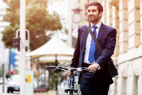 Young businessmen with a bike