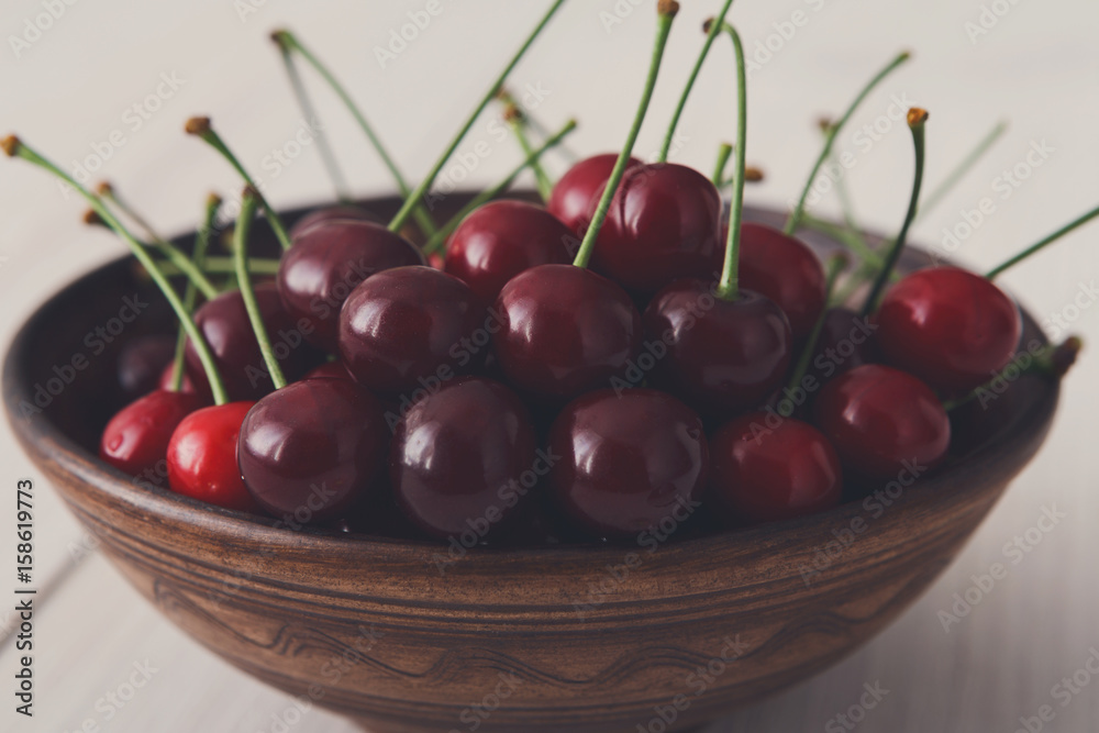 Sweet fresh cherries on white wood background Sweet fresh cherries on white wood background