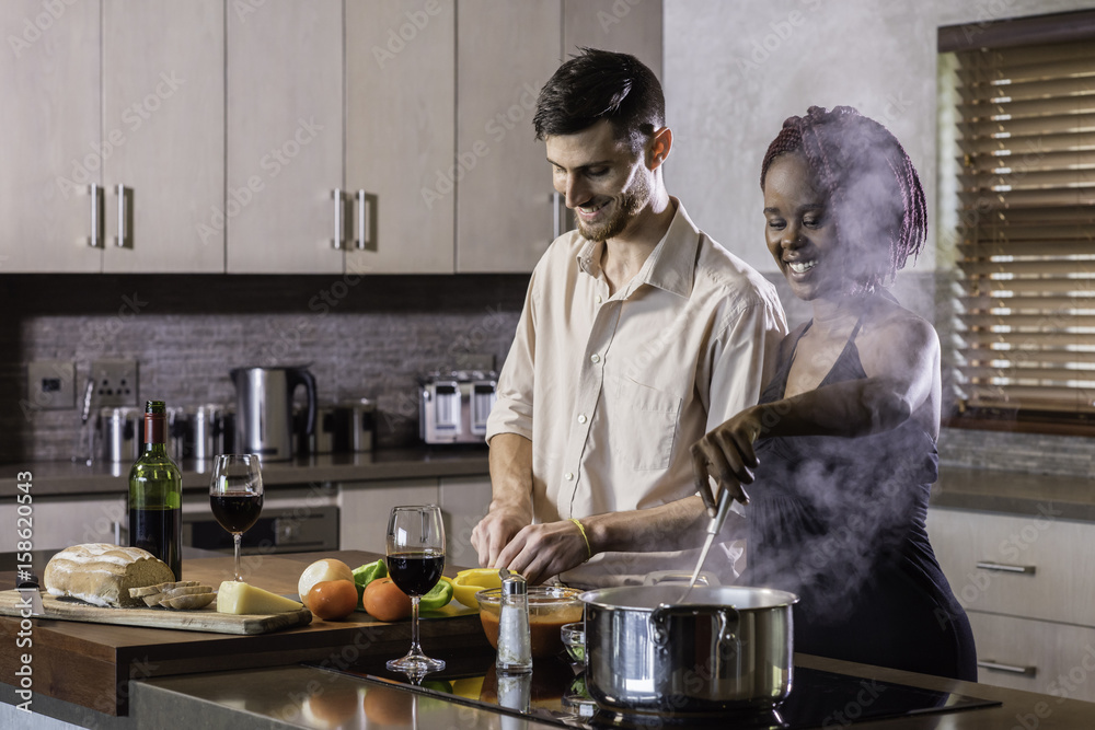 dinner preparation kitchen cooking happy young mixed race couple dinner preparation kitchen cooking happy young mixed race couple