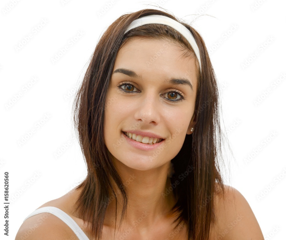 Portrait of a young brunette woman isolated on  white background