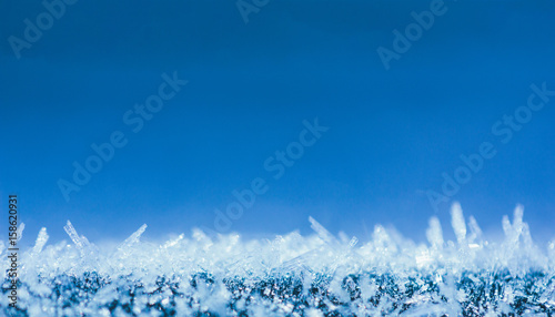 winter background with glittering ice crystals with copy space, macro photos. shallow depth of field