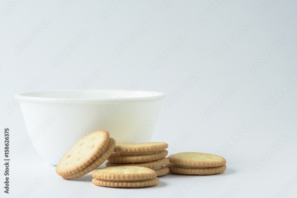 Crackers and a white bowl Crackers and a white bowl