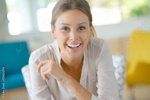 Free Download Portrait of beautiful woman relaxing at home - GFXLoad