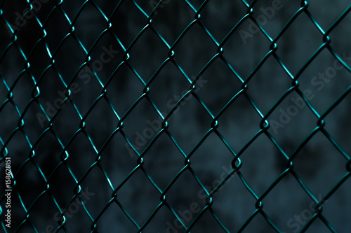 Steel mesh against wall background