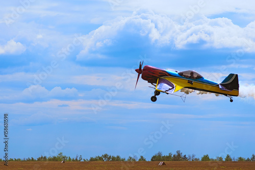 Third AirFestival at Chaika airfield. A small sports plane flies at a low altitude. Kyiv  Kiev . Ukraine