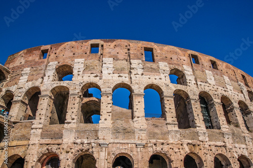 View of Colosseum in Rome and morning sun, Italy, Europe.