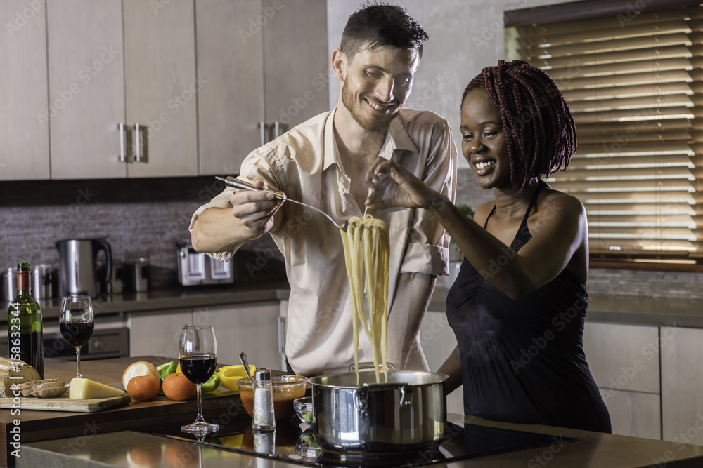 dinner preparation kitchen cooking happy young mixed race couple dinner preparation kitchen cooking happy young mixed race couple