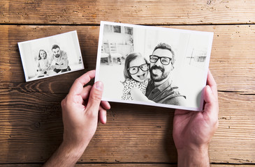 Pictures of father and daughter, wooden background. Fathers day.