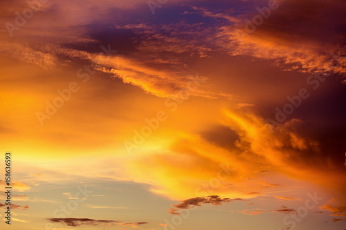 Colorful dramatic sky with cloud at sunset.Sky with sun background