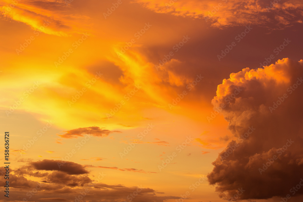 Colorful dramatic sky with cloud at sunset.Sky with sun background Colorful dramatic sky with cloud at sunset.Sky with sun background