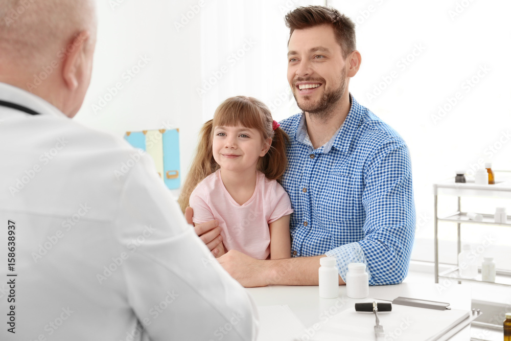 Fototapeta premium Little girl with father at doctor's office