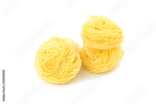 Raw Angel Hair Pasta isolated on white background