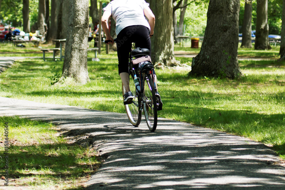 Fototapeta premium Riding a bike in the park