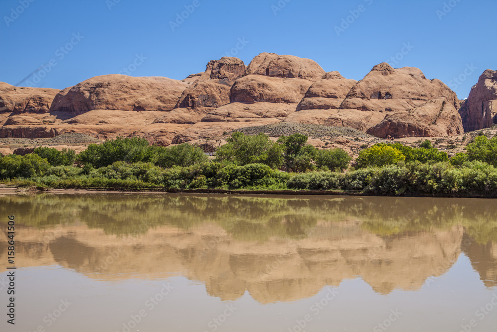 Red rocks reflecting in the Colorado River, Utah