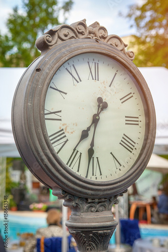 Tall Antique Outdoor Community Clock photo