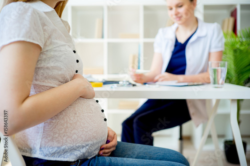 Pregnant woman visiting doctor