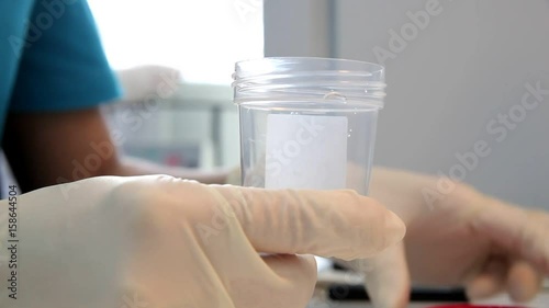 A doctor prepares a semen sample