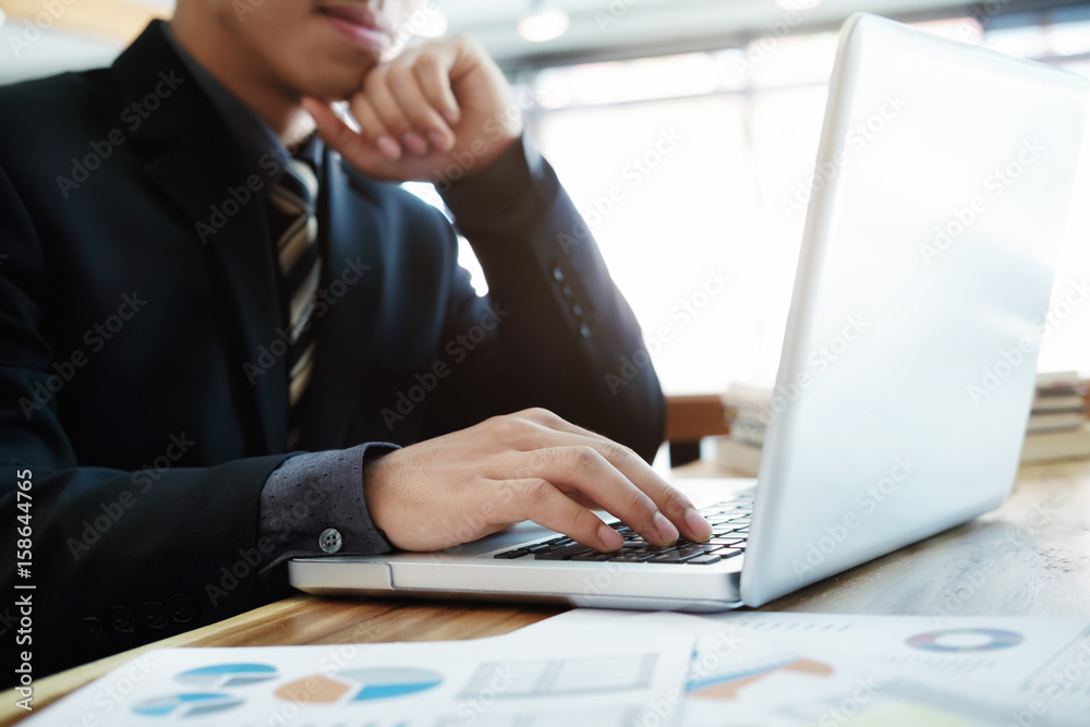Close up businessman working with laptop Close up businessman working with laptop