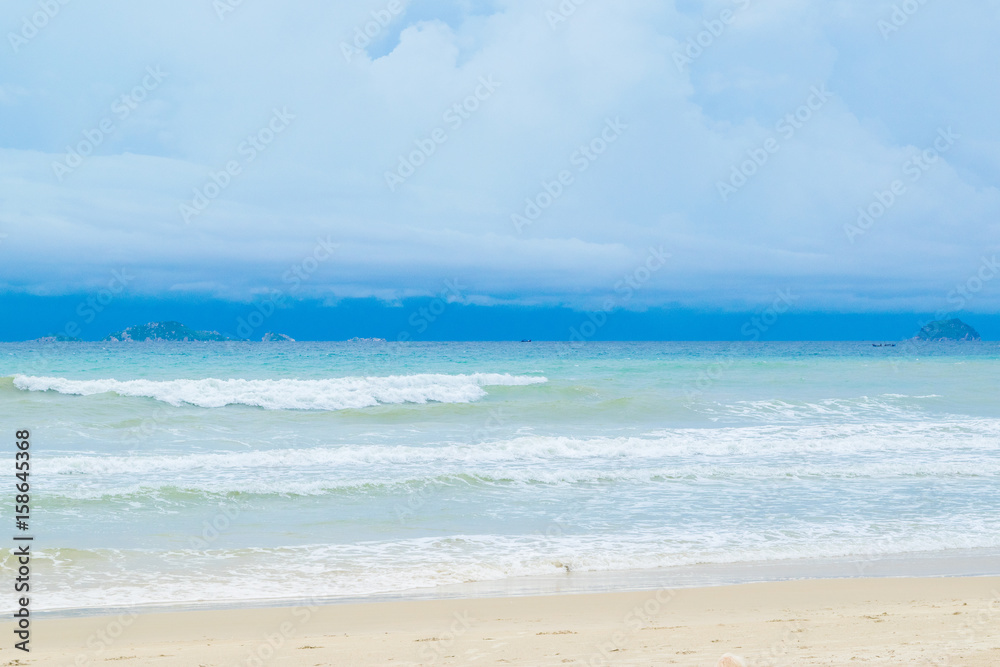 Desert sand beach with blue sky and waves,  Vietnam, Nha trang, South China sea