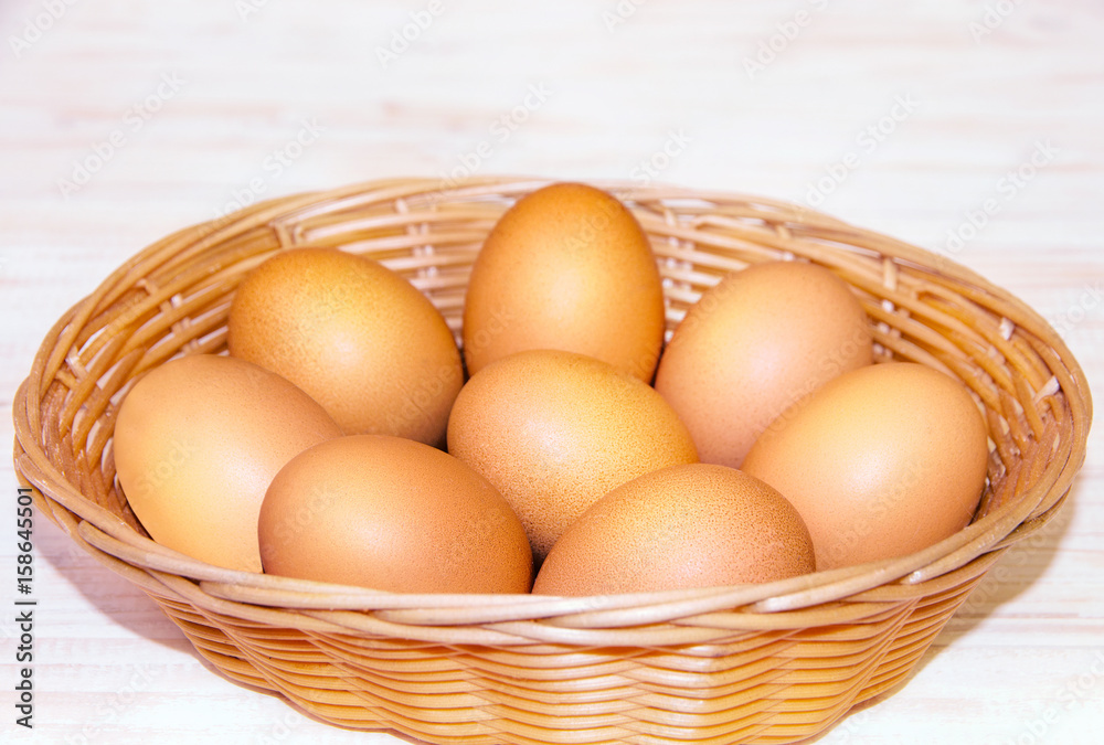 Eggs in a wicker basket on a table Eggs in a wicker basket on a table