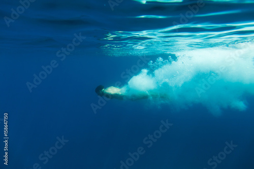 man dive underwater